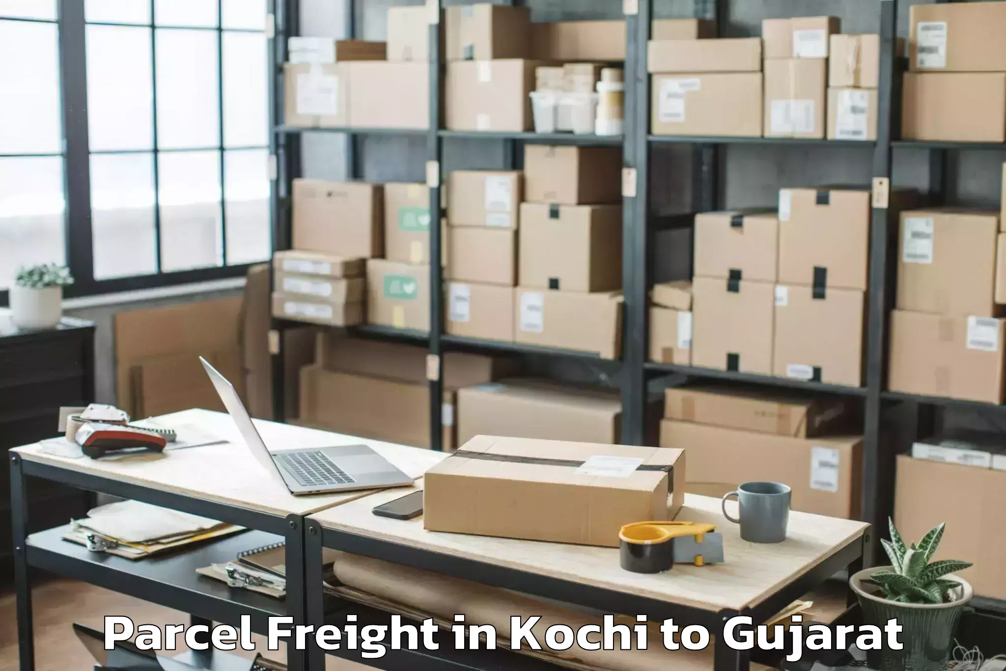 Professional Kochi to Keshod Airport Ixk Parcel Freight